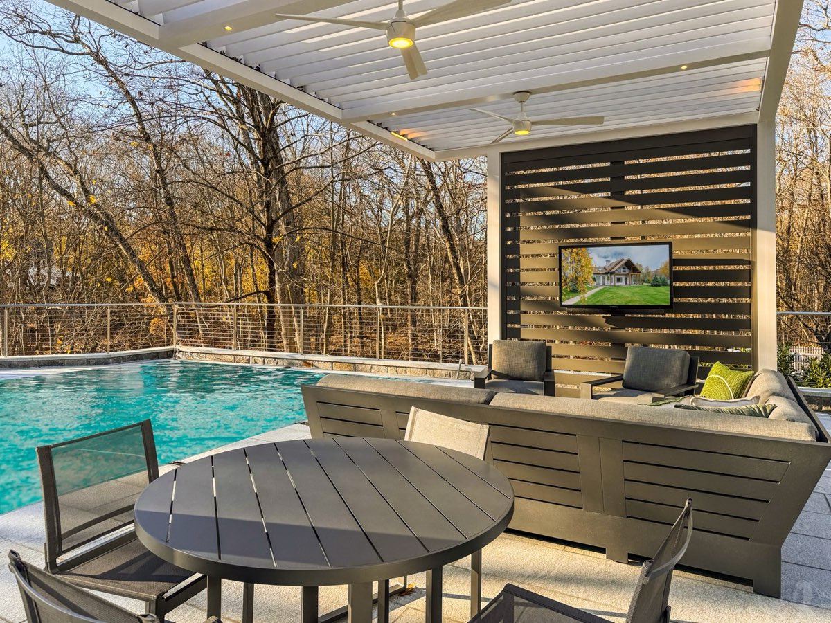 Motorized louvered pergola over pool deck